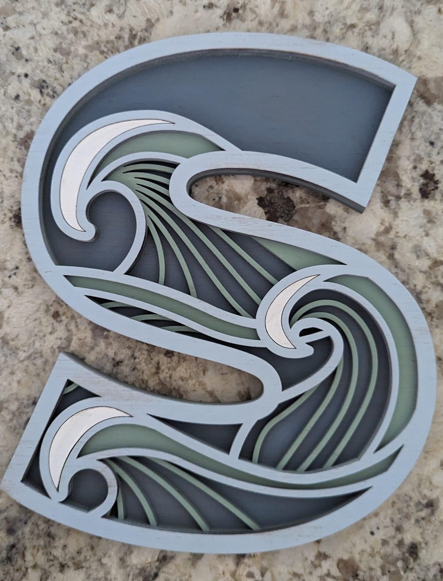 "S" layered wood decor