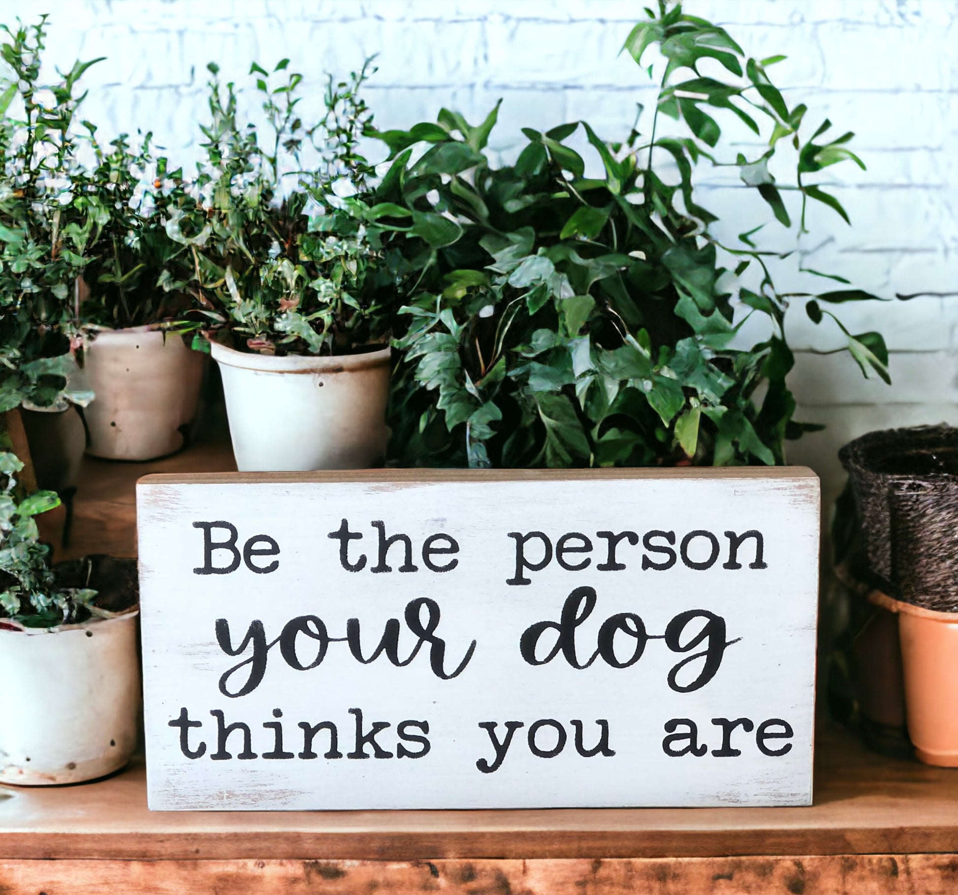 "Be the person your dog thinks you are" wood sign