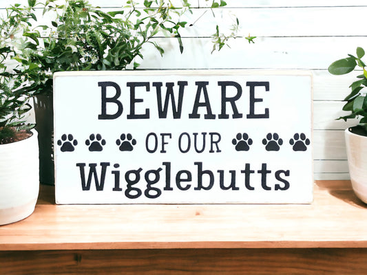 "Beware of wigglebutts" wood sign