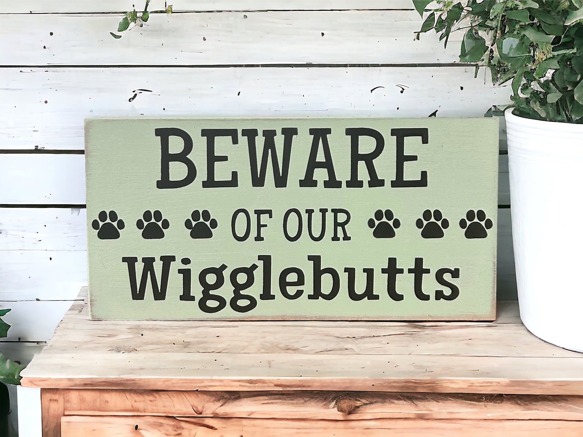 "Beware of wigglebutts" wood sign