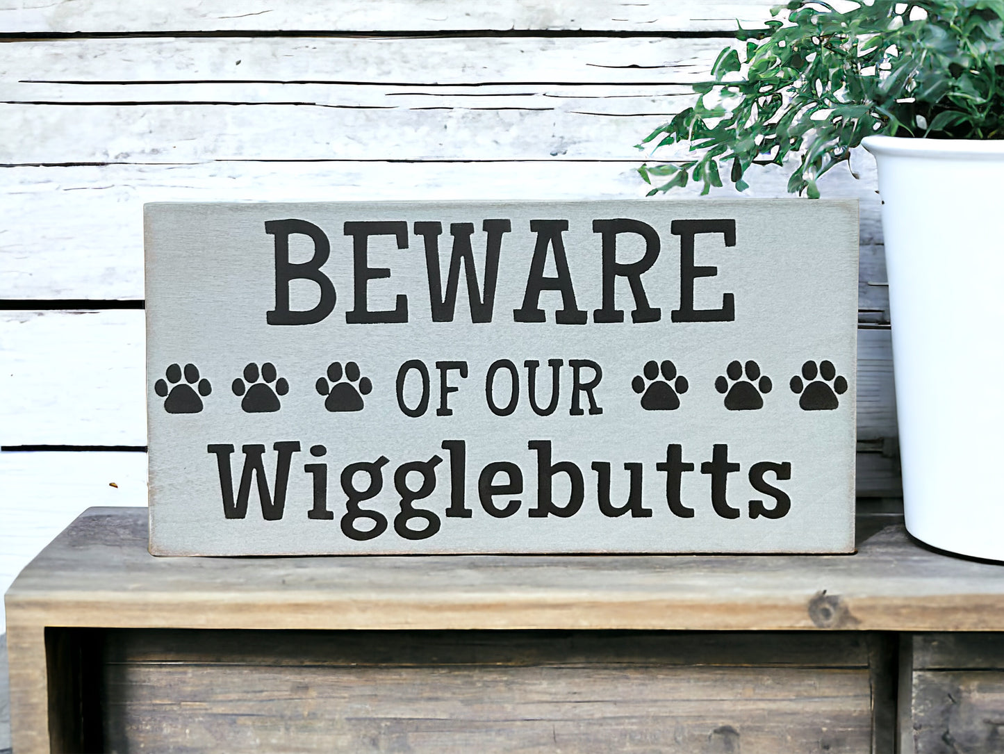 "Beware of wigglebutts" wood sign