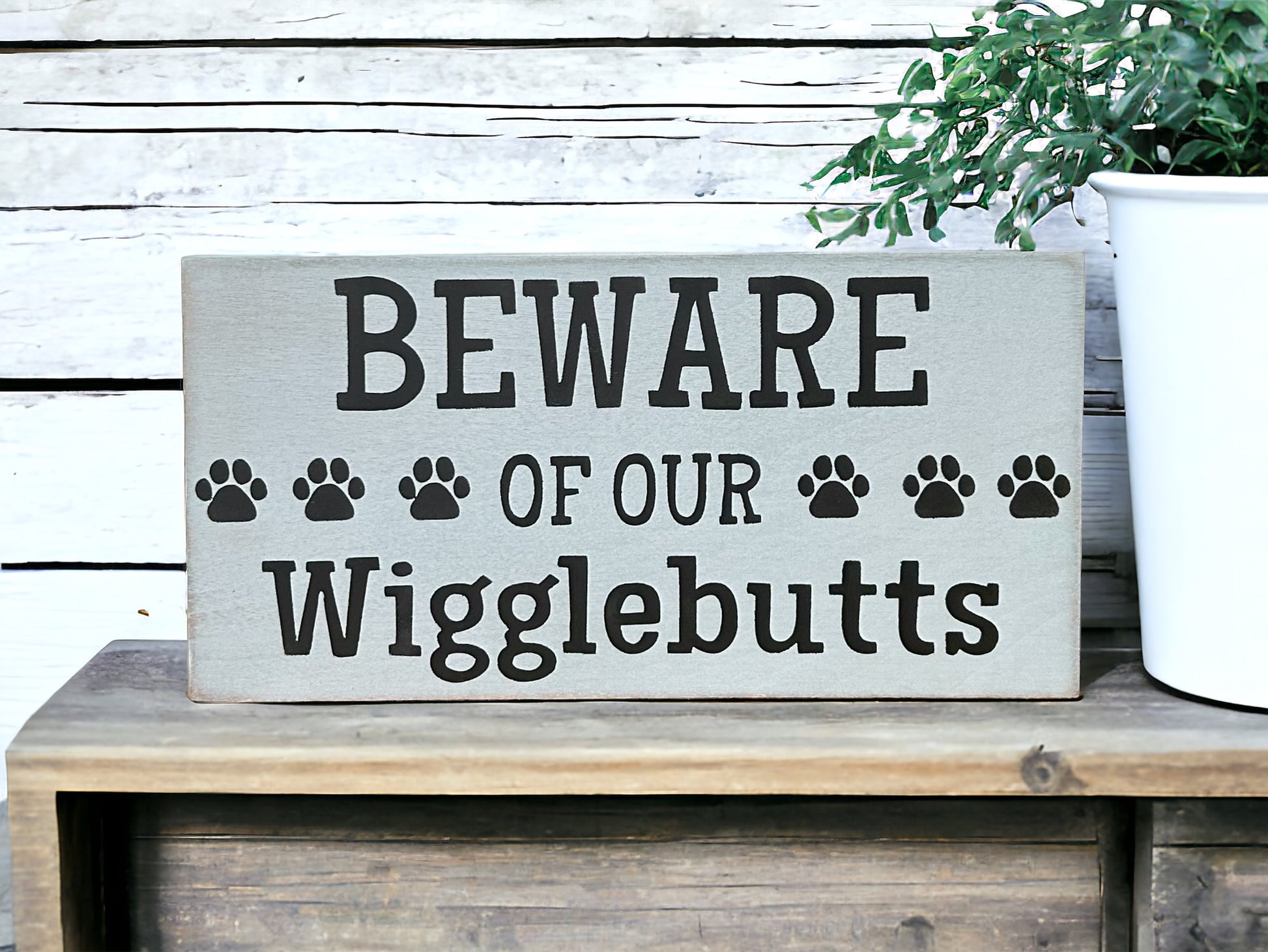 "Beware of wigglebutts" wood sign