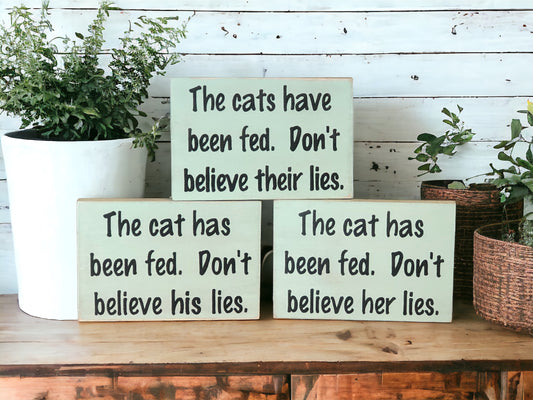 "Cat has been fed" wood sign