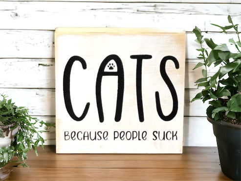 "Cats becasue people suck" wood sign