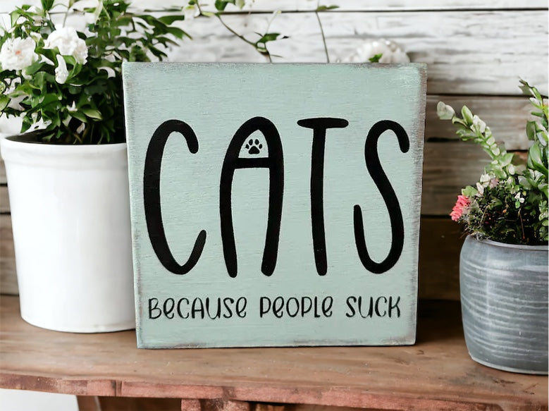 "Cats becasue people suck" wood sign