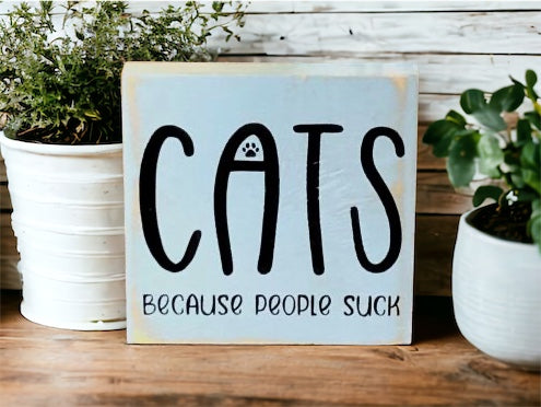 "Cats becasue people suck" wood sign