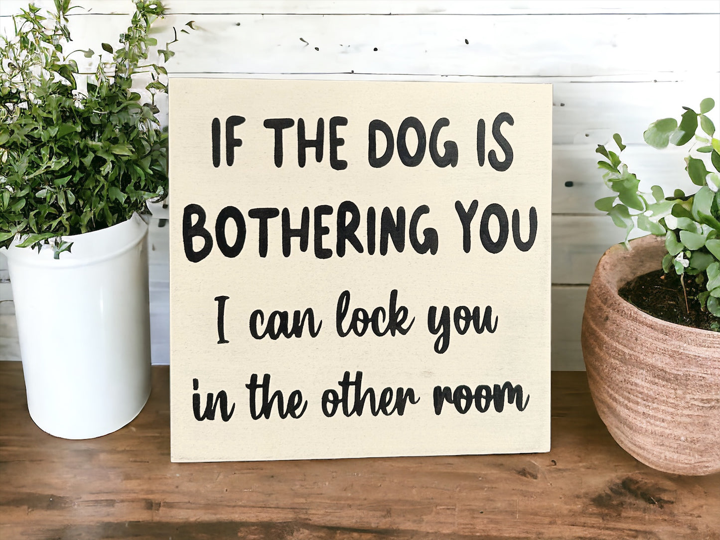 "Dogs because people suck" wood sign