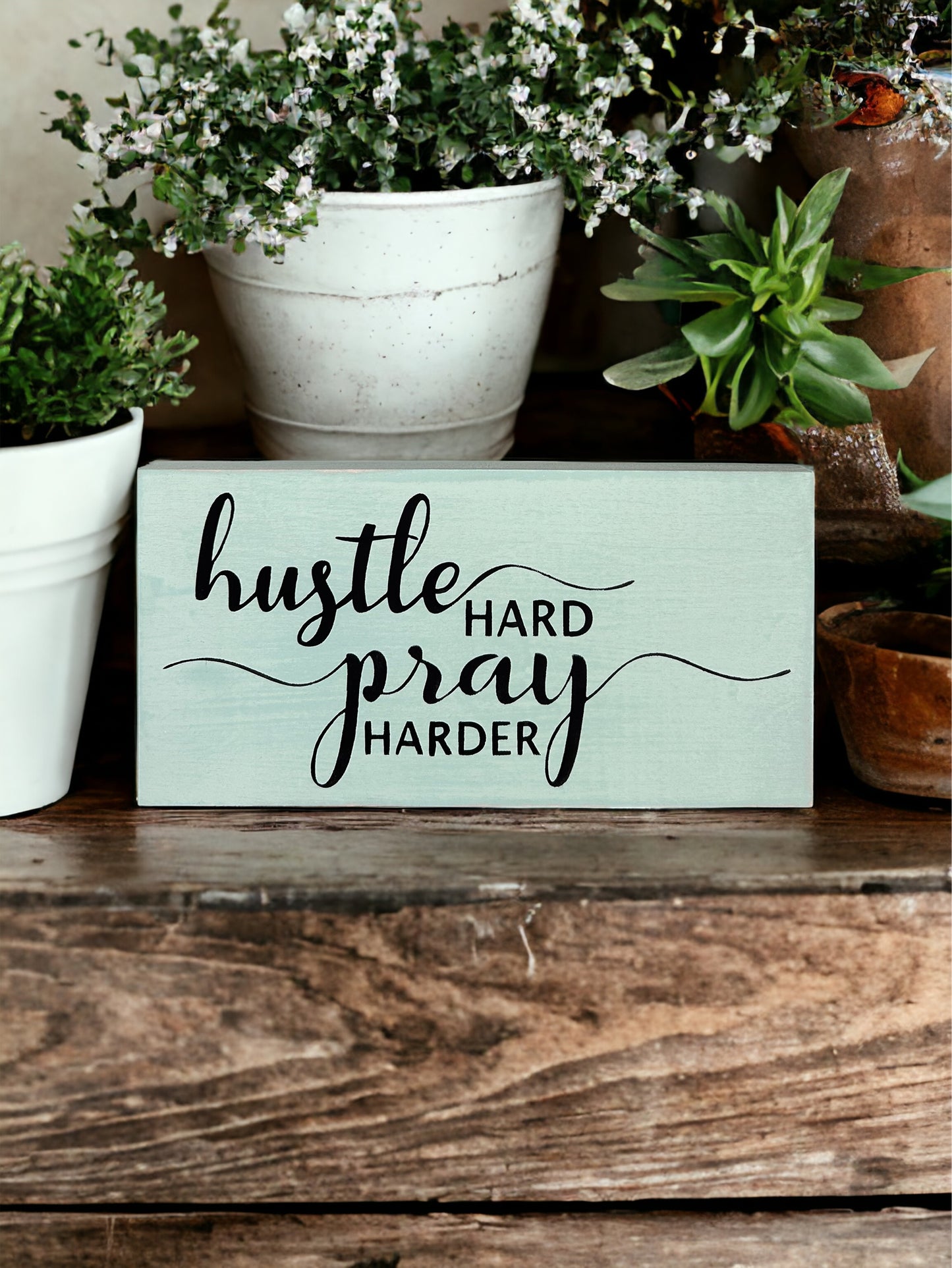 "Hustle pray" wood sign