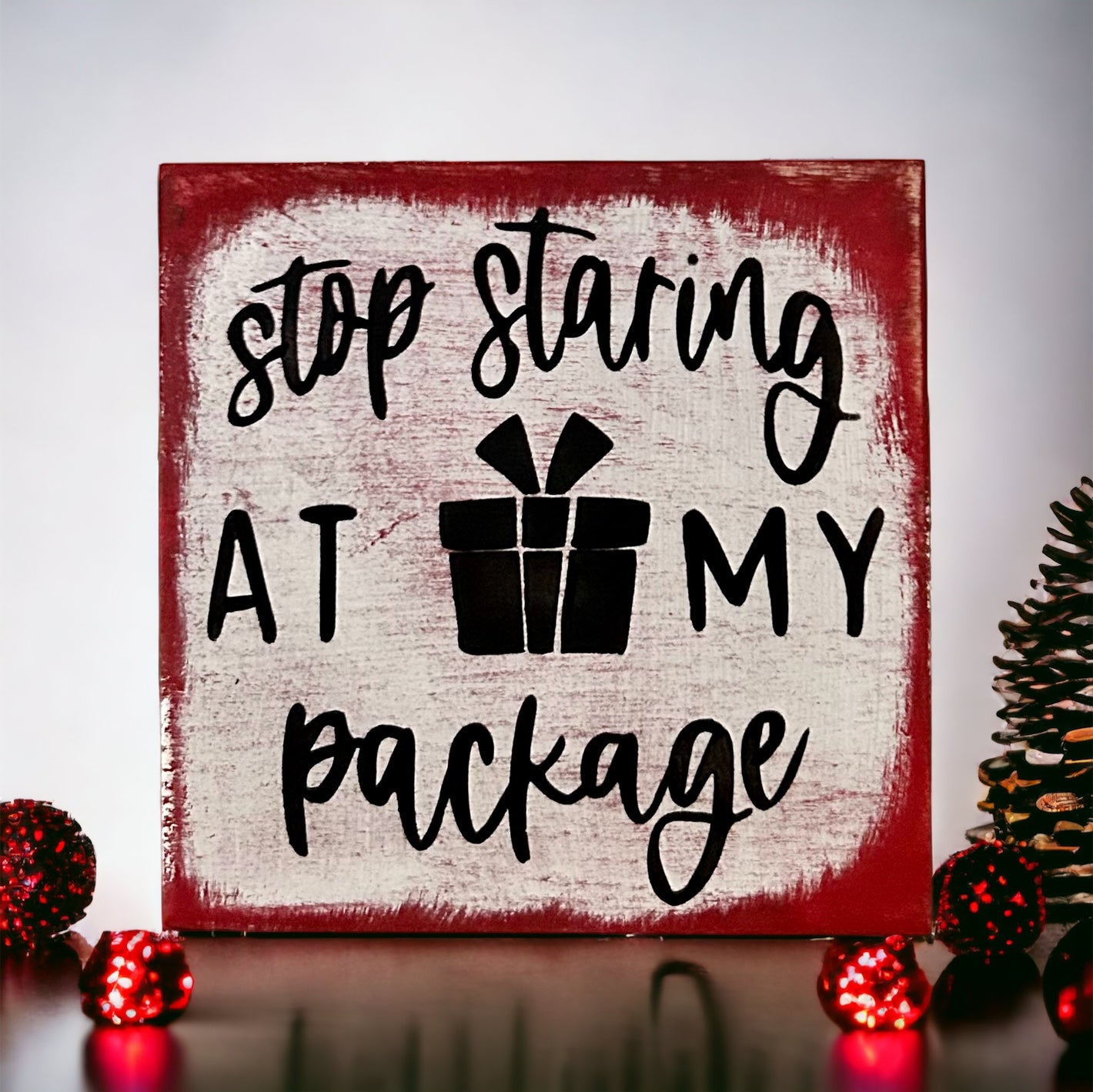 "staring at my package" wood sign