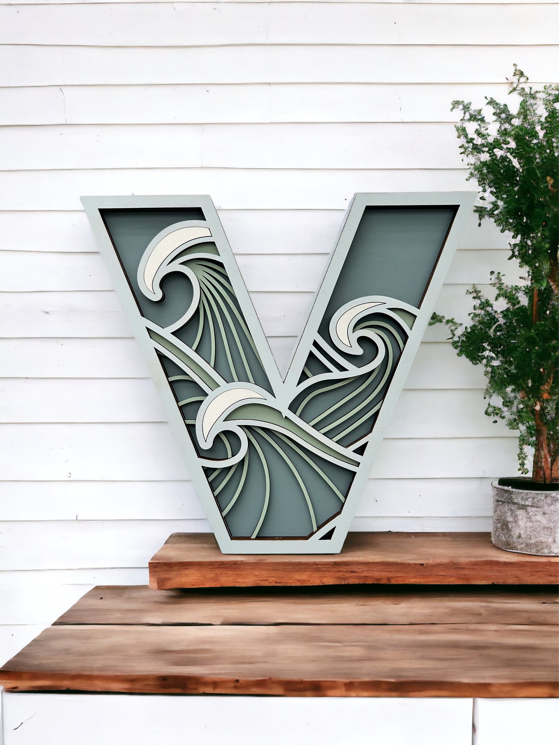 Layered wood letter "V"