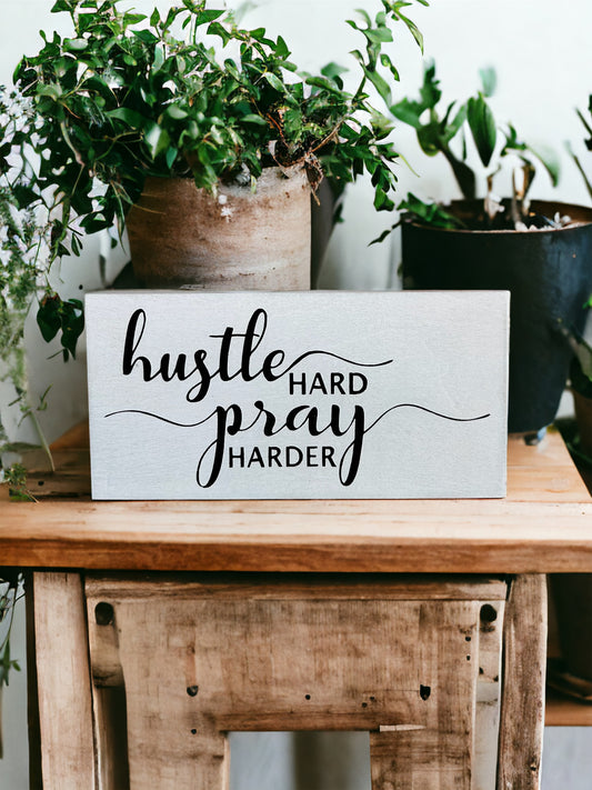 "Hustle pray" wood sign