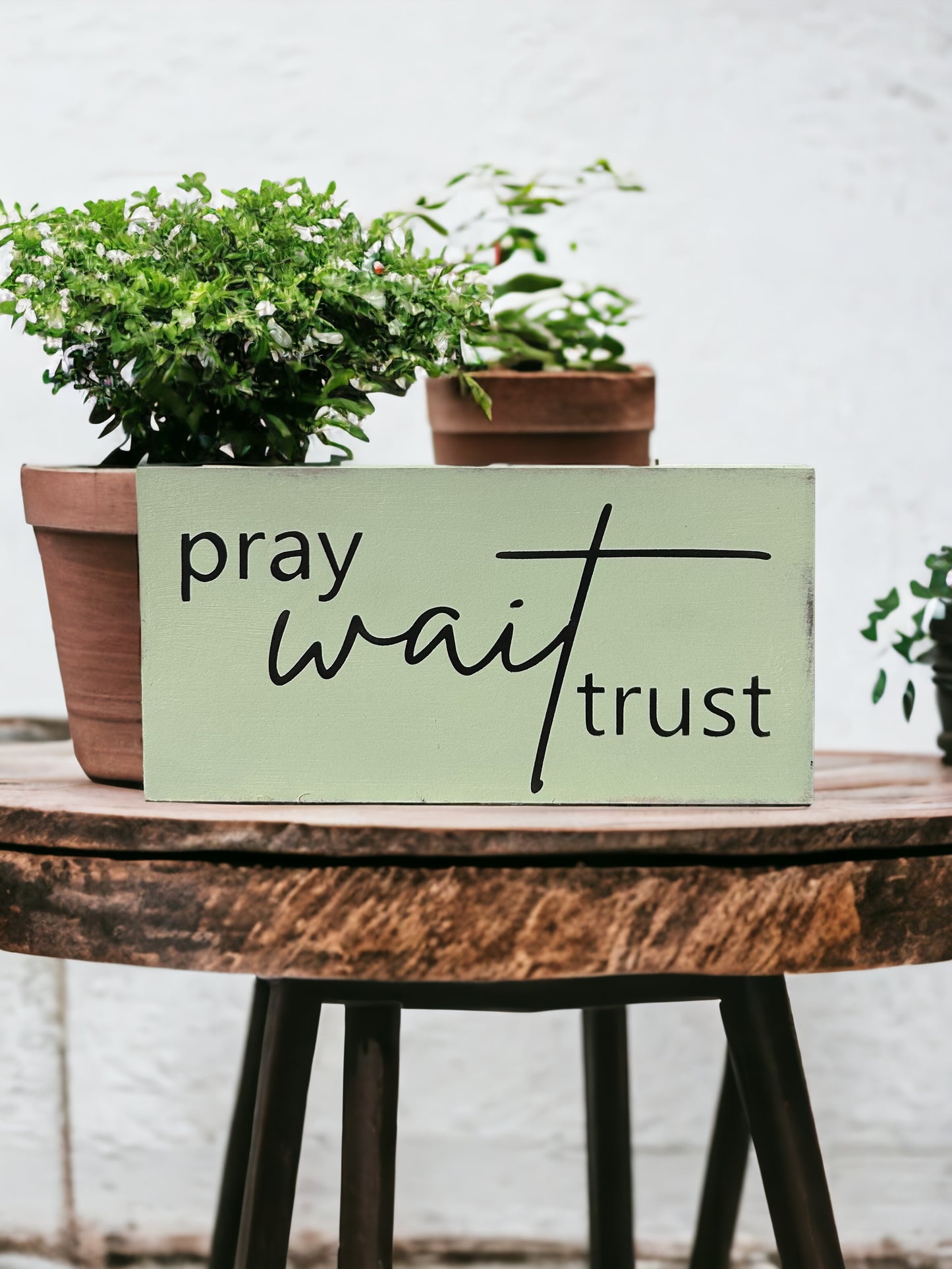 "Pray wait trust" wood sign