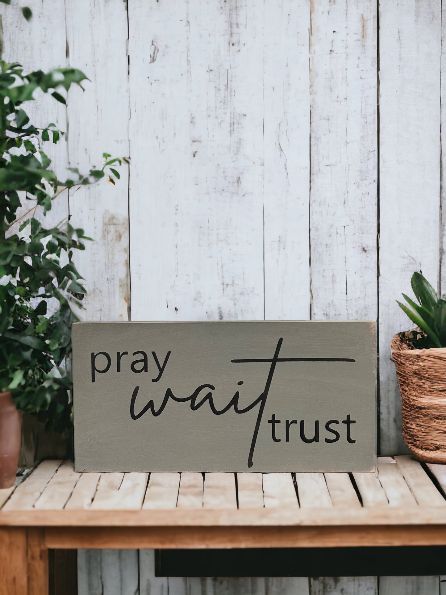 "Pray wait trust" wood sign
