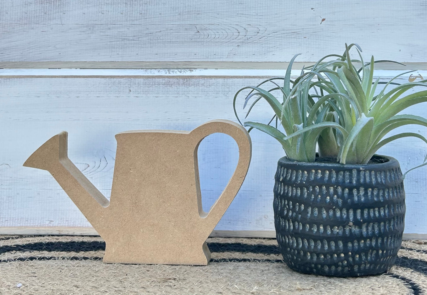 wood watering can
