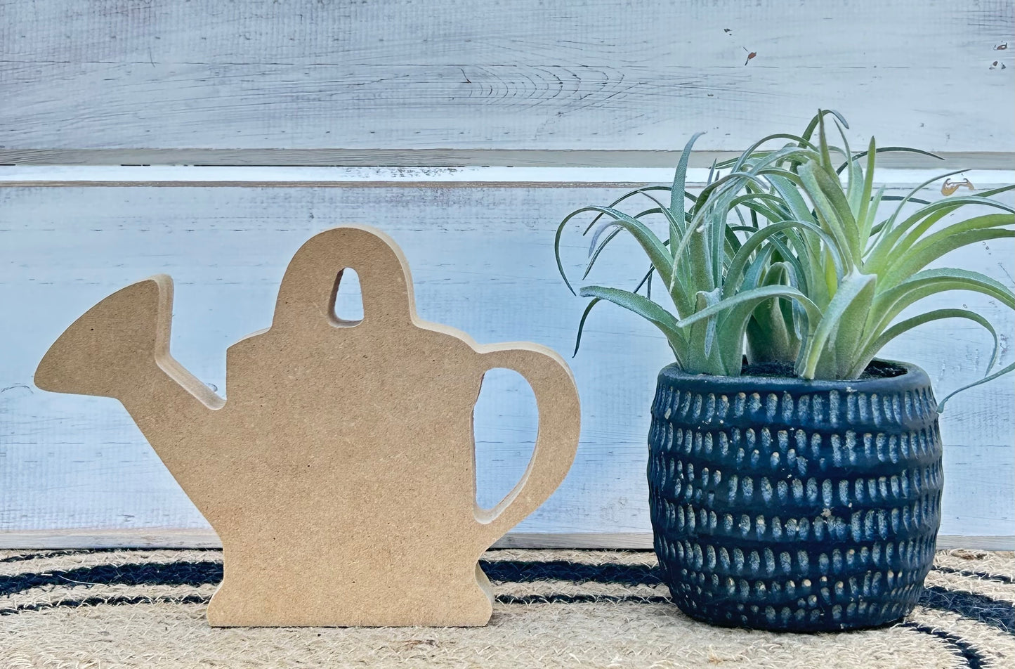wood watering can