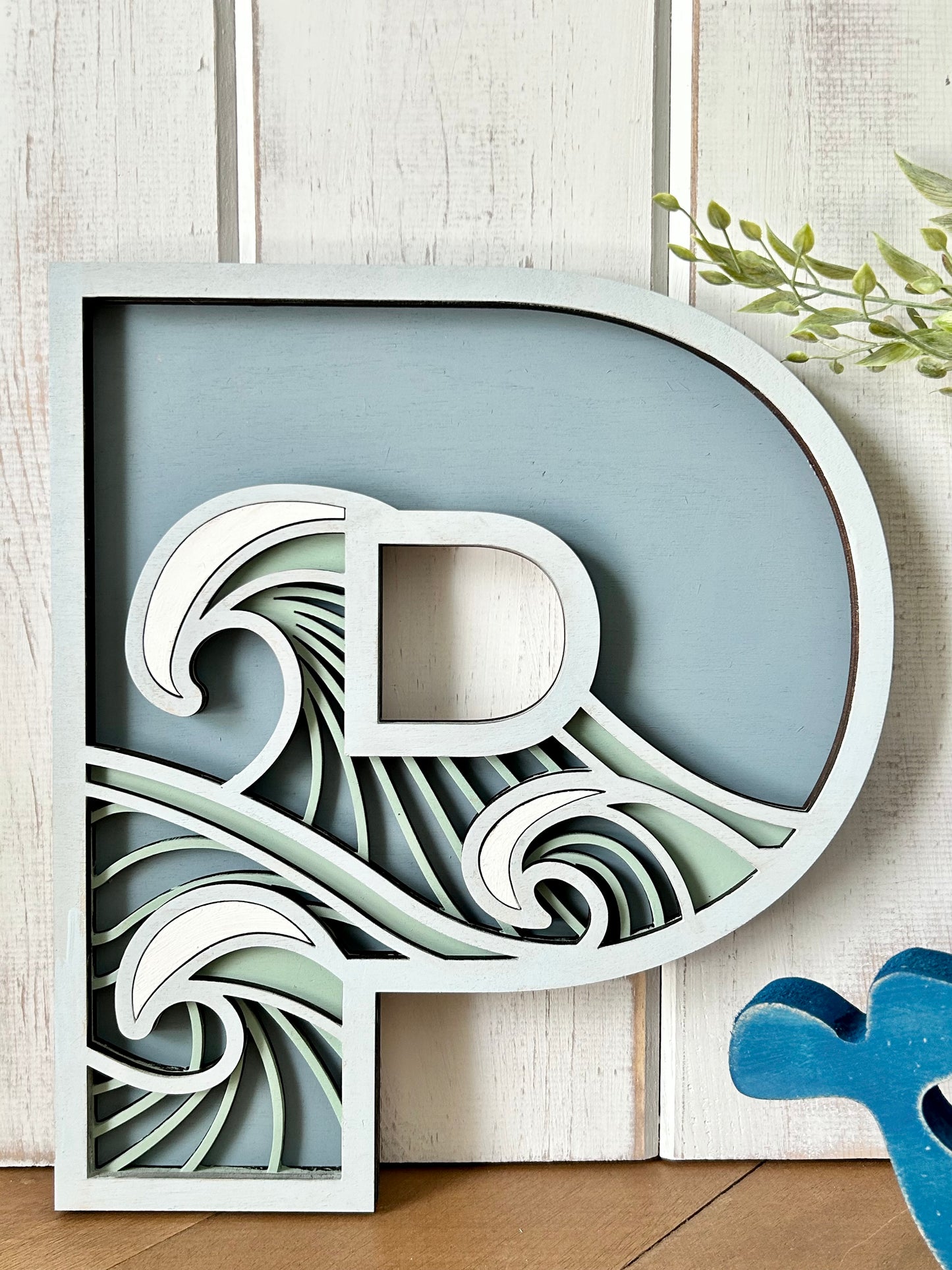 "P" layered wood decor
