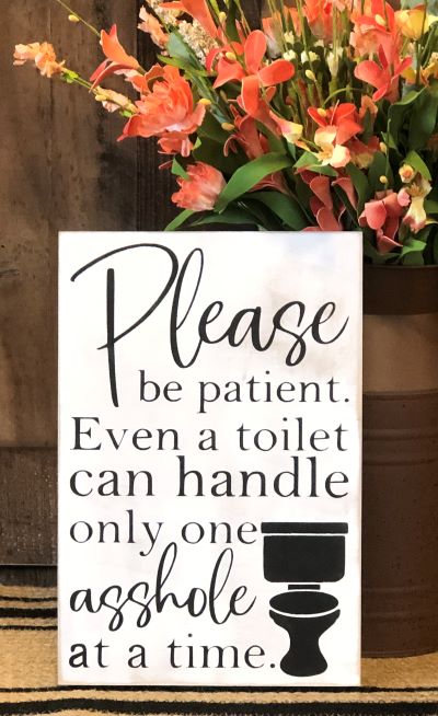 "One asshole at a time" funny wood sign