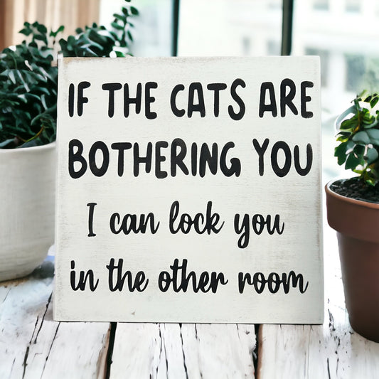 "Cats bothering you" funny wood sign