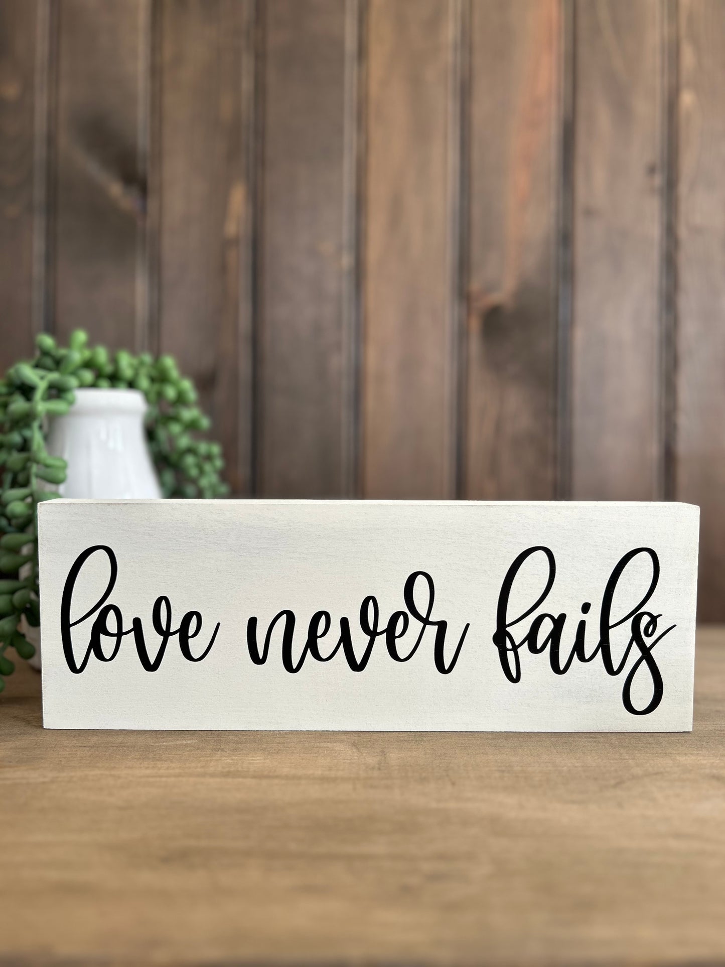 Love Never Fails - Rustic Wood Sign