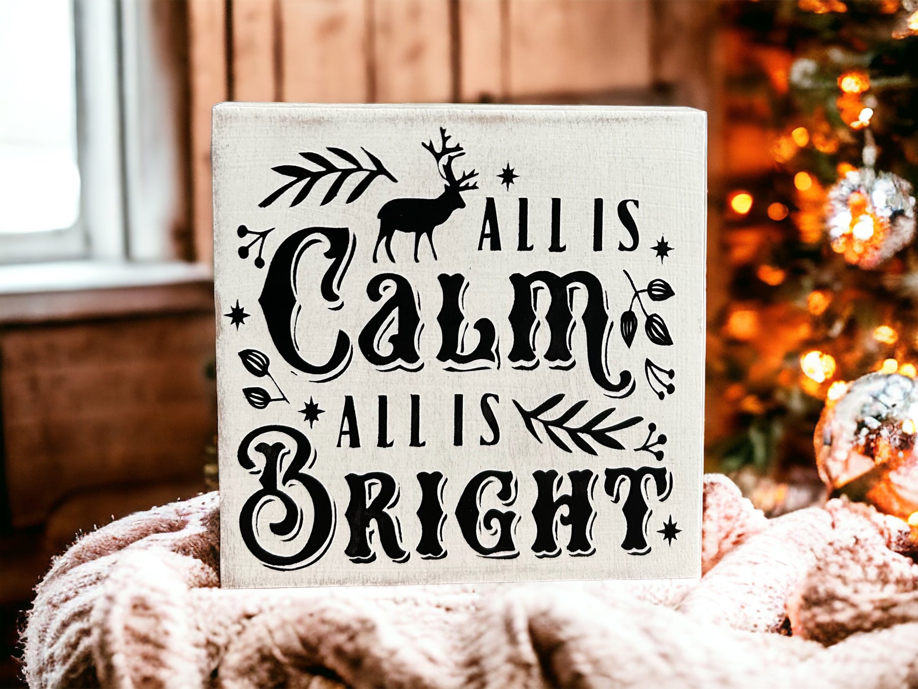 "Calm and bright" wood sign