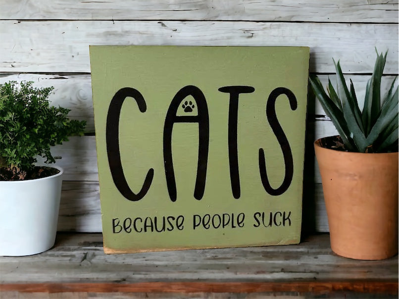 "Cats becasue people suck" wood sign