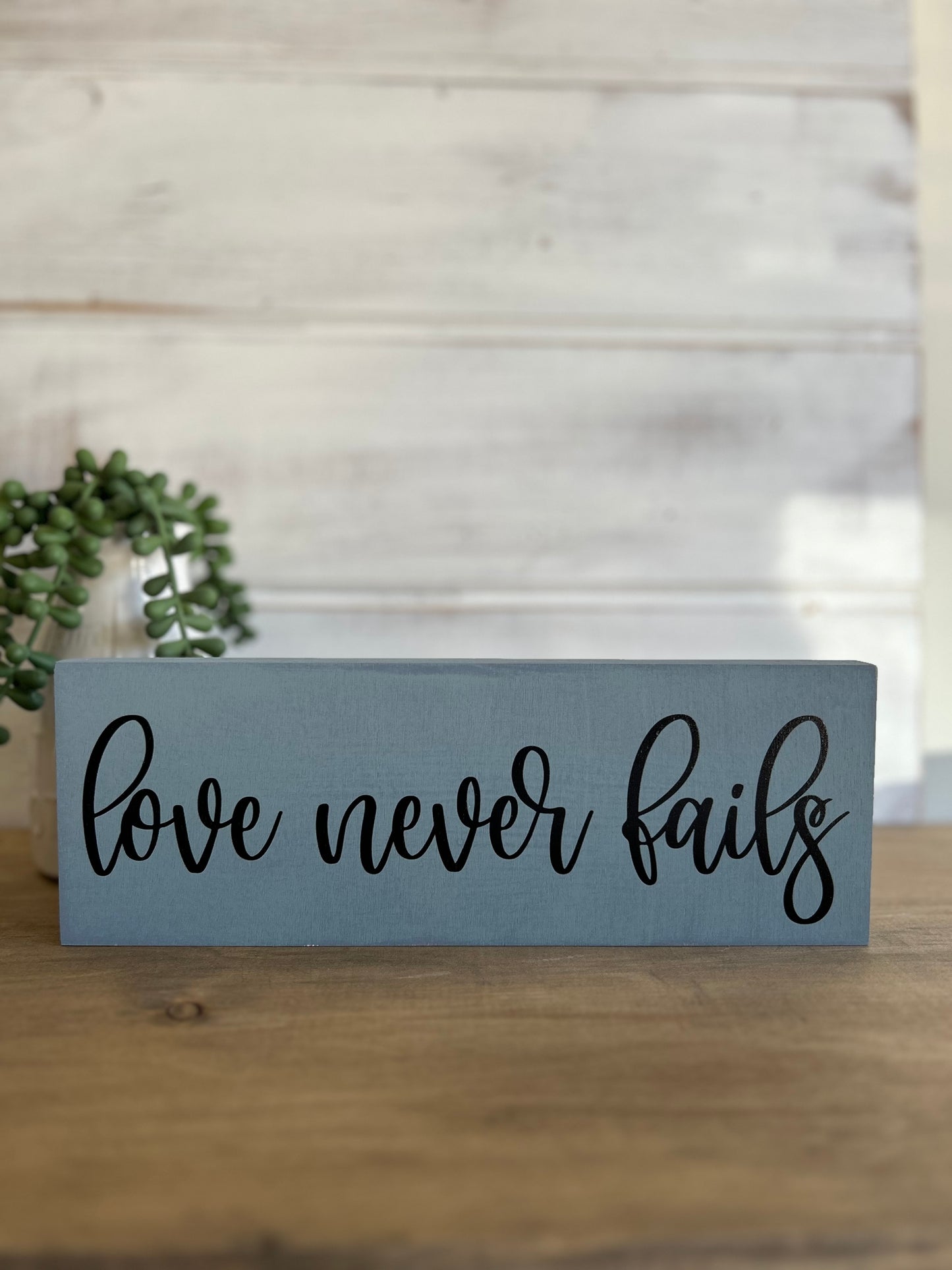Love Never Fails - Rustic Wood Sign