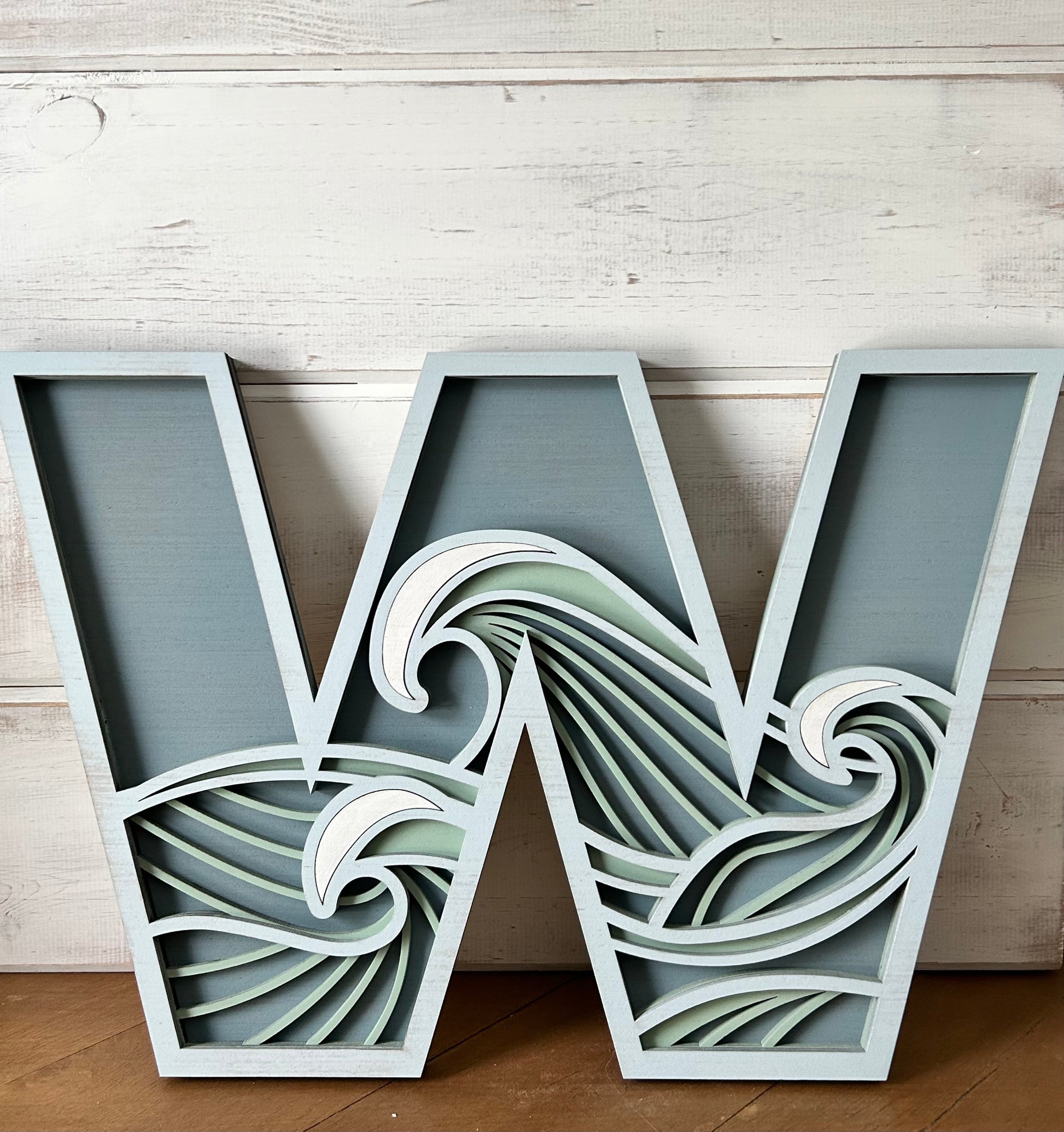 "W" layered wood decor