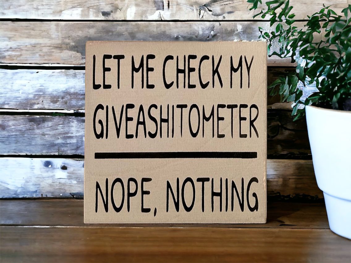 "Giveashitometer" wood sign