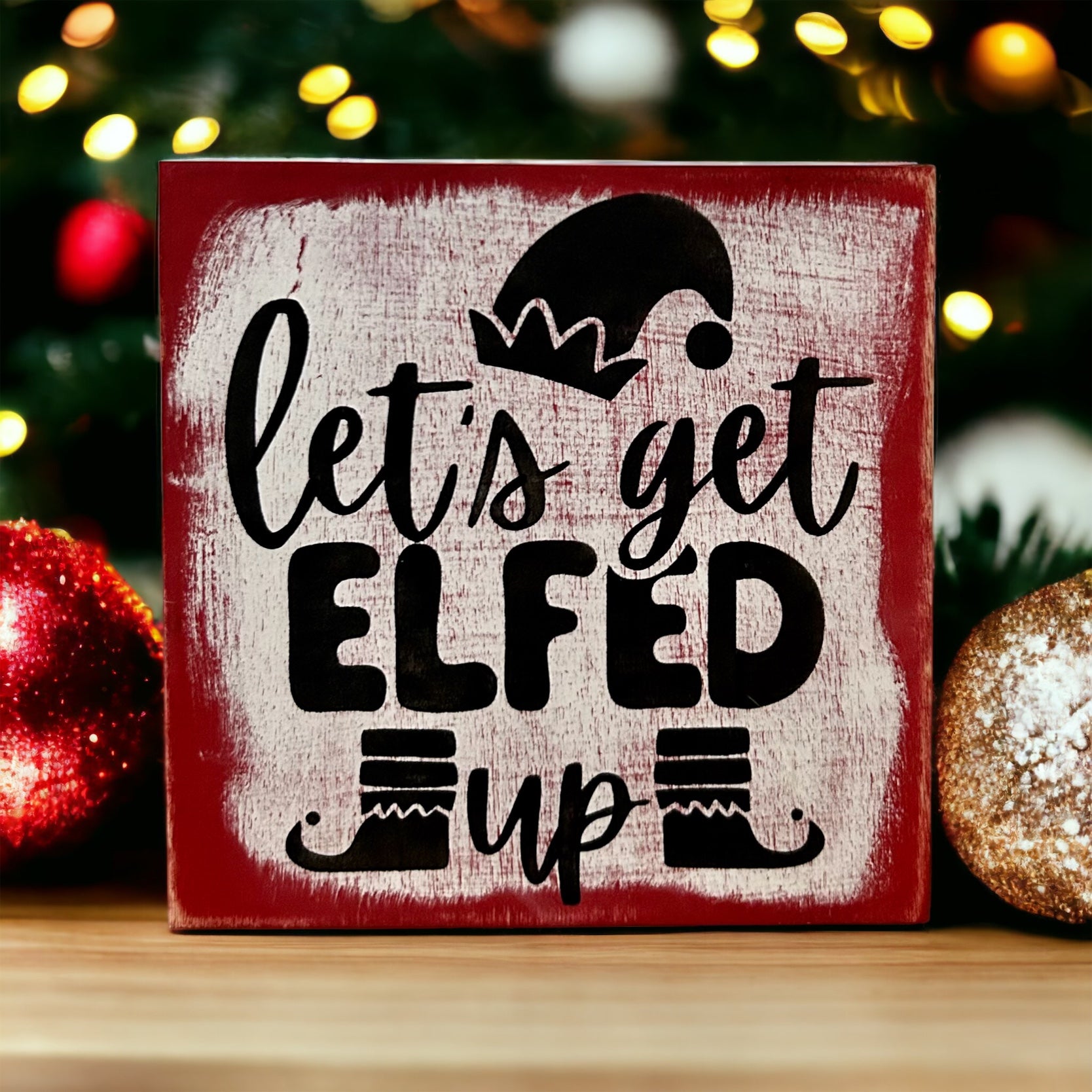 "let's get elfed up" wood sign