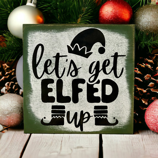"let's get elfed up" wood sign