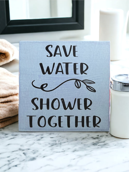 "Save water, shower together" funny wood sign