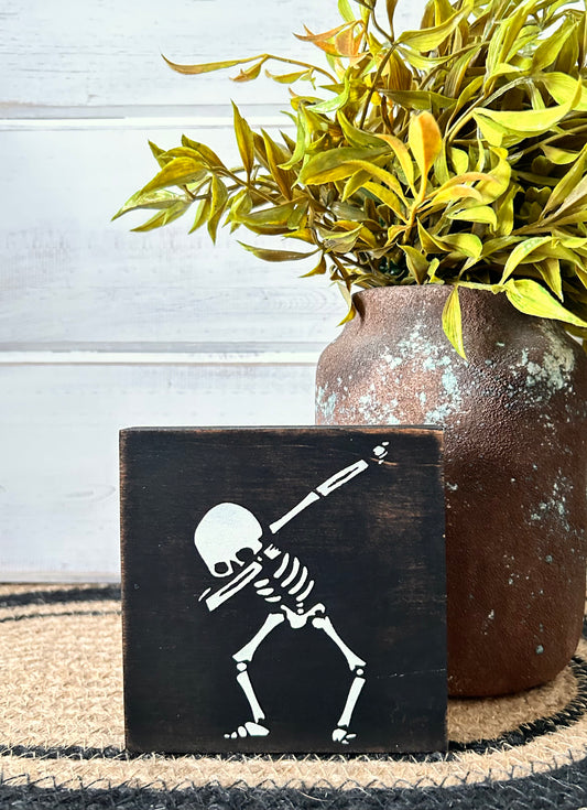 skeleton wood sign