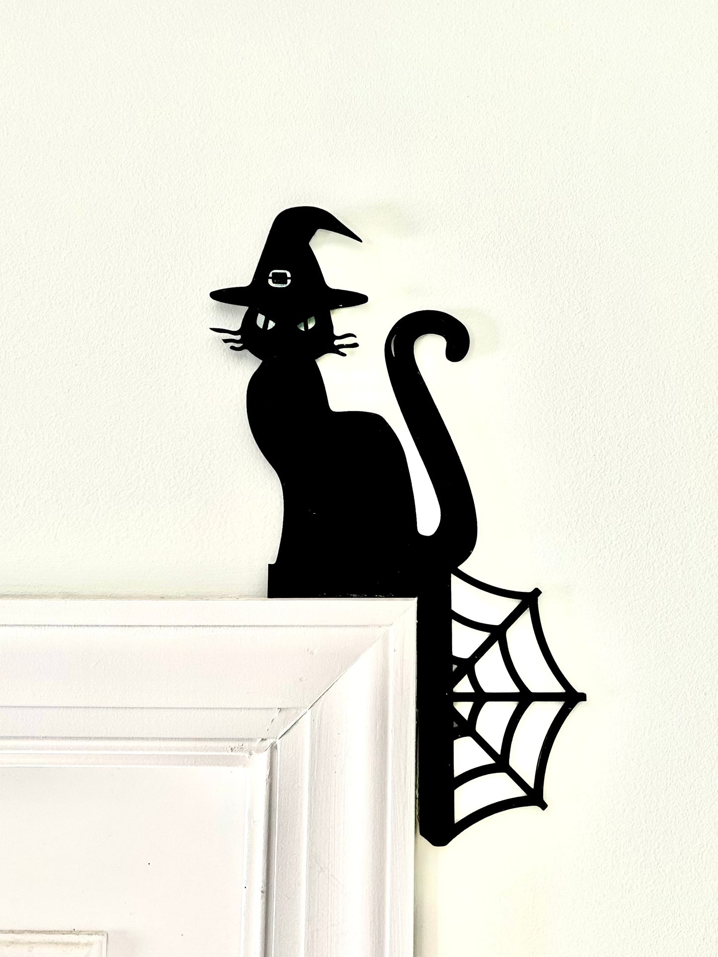 Cat in a witch hat trim corner