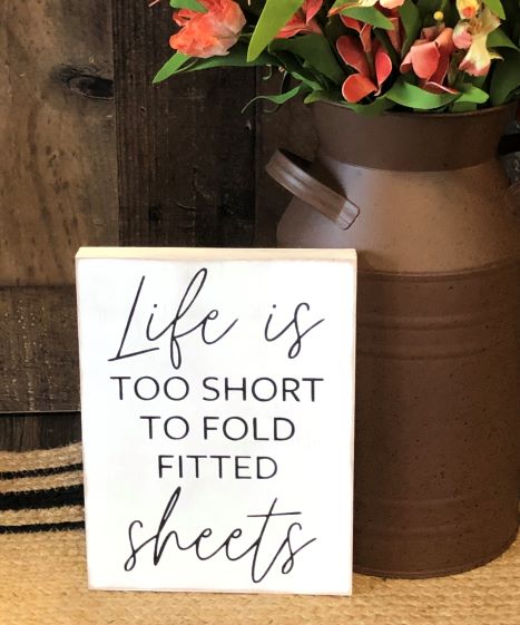 "Life is too short to fold fitted sheets" wood sign