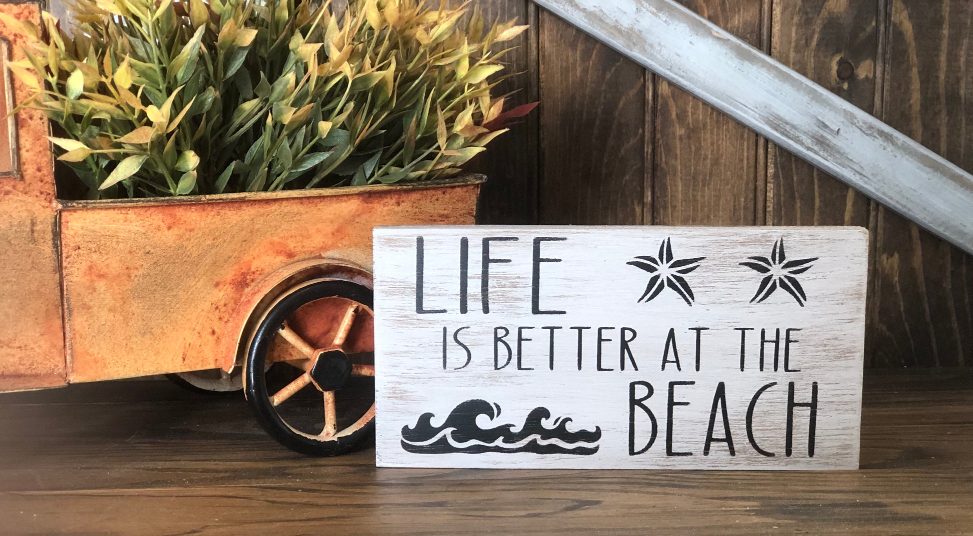 "Better at the beach" wood sign