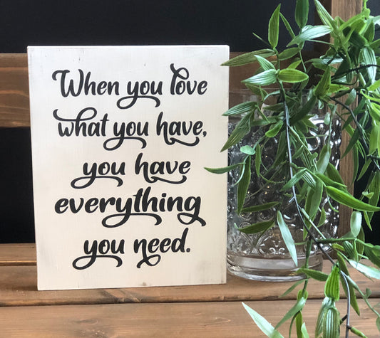 "Love what you have" wood sign